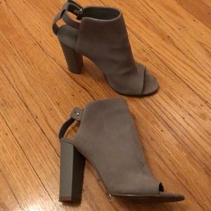 Suede Vince booties with a chic peep-toe profile